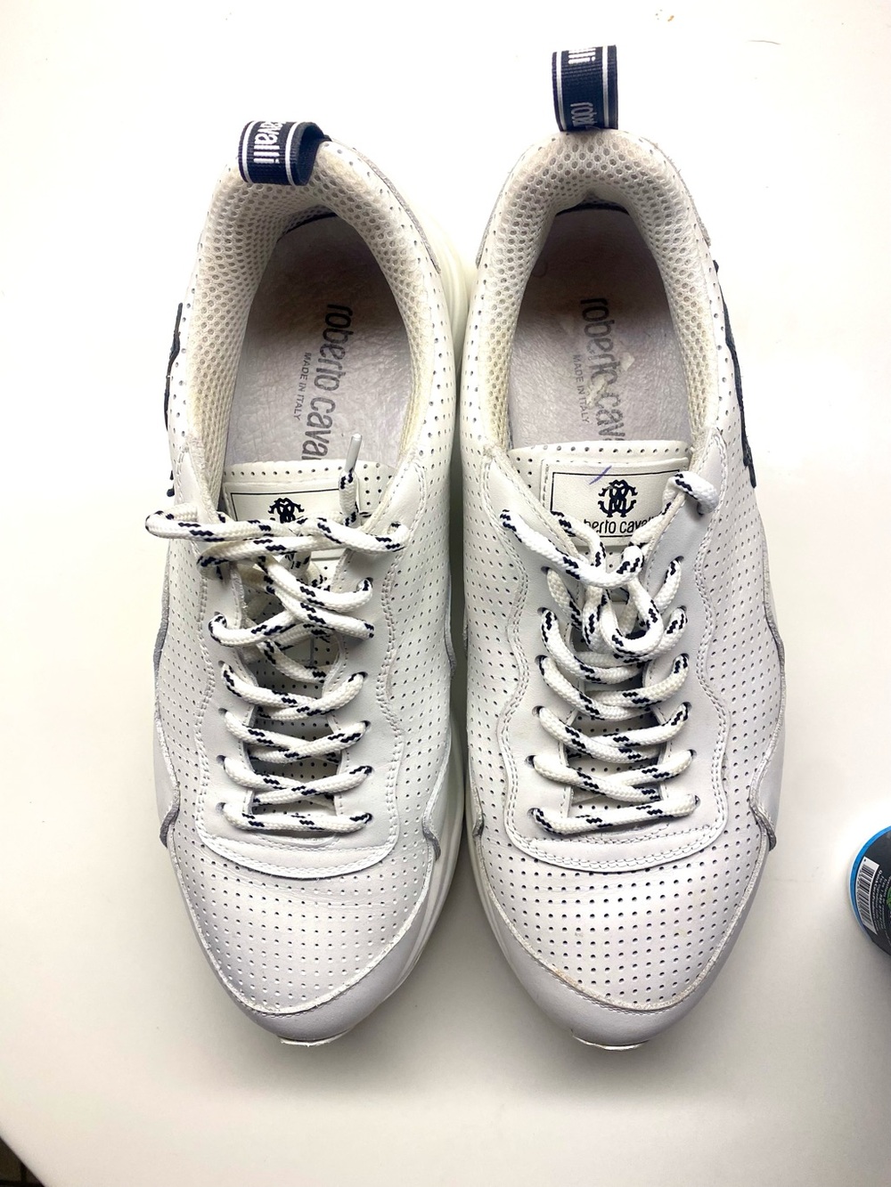Roberto Cavalli White Sneakers with black trim.